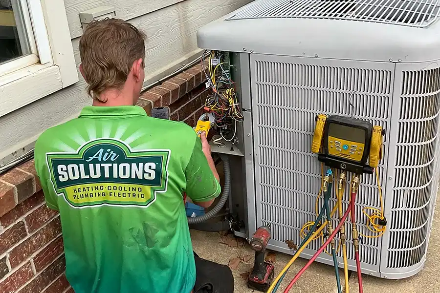 Air Solution technician performing AC repair